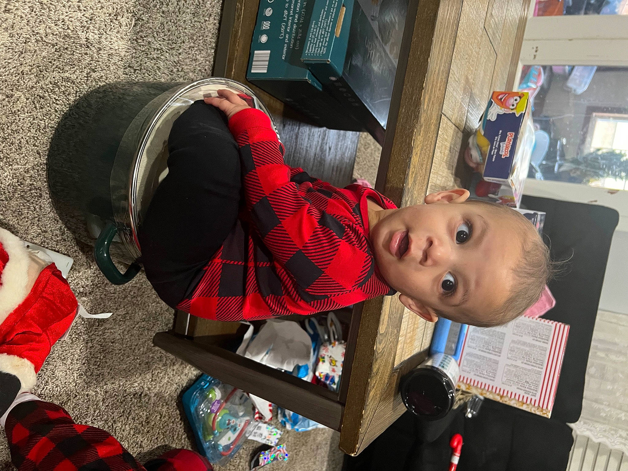 Tristyn is registered to the contest to win money with this photo: audio_equipment, baby, carmine, child, costume, event, fun, hat, holiday, pattern, person, personal_protective_equipment, plaid, smile, surprise, tartan, toddler, toy