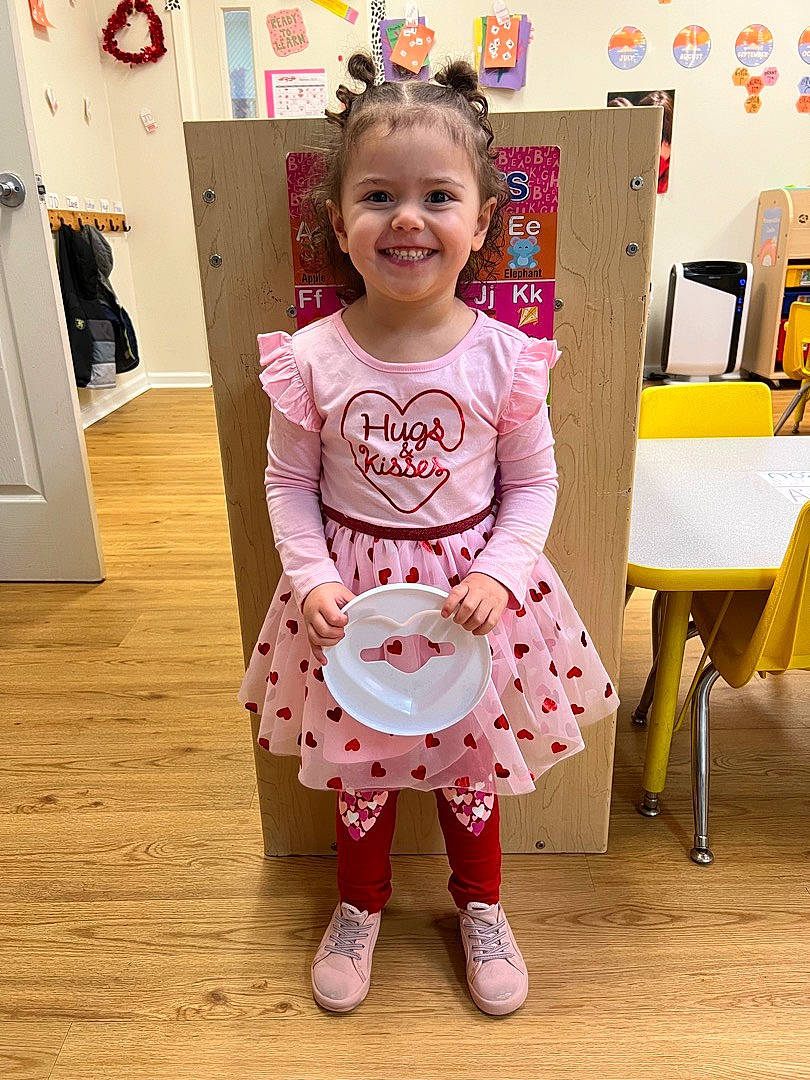 Adisyn joined the competition — help win amazing prizes! baby_toddler_clothing, child, event, eye, face, flooring, happy, hardwood, joy, magenta, pattern, peach, person, pink, product, room, sleeve, smile, standing, t_shirt