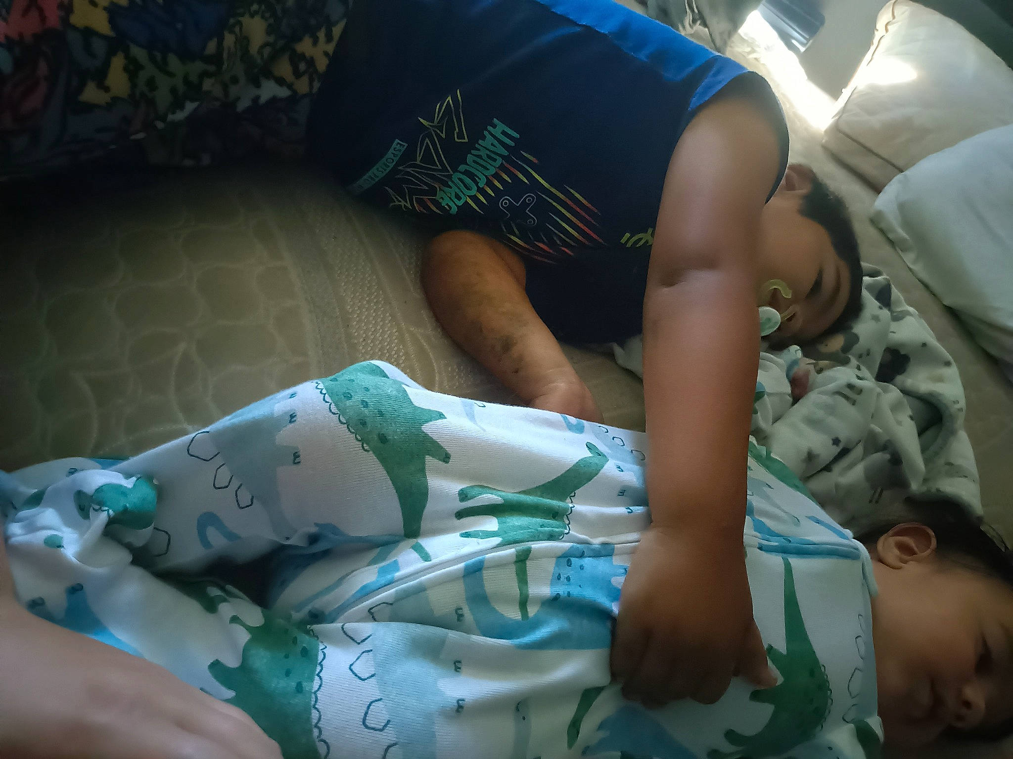 Matteo is registered to the contest to win money with this photo: baby, barefoot, child, comfort, elbow, finger, flesh, foot, human_body, human_leg, knee, leisure, linens, nail, person, room, shorts, sitting, thigh, toddler