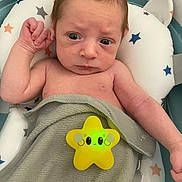 Johnathon joined the competition — help win amazing prizes! baby, infant, bath, towel, star_toy, pillow, water, skin, face, expression, hand, arm, cute, indoor, child, newborn, relaxing, comfort, bath_time, toy