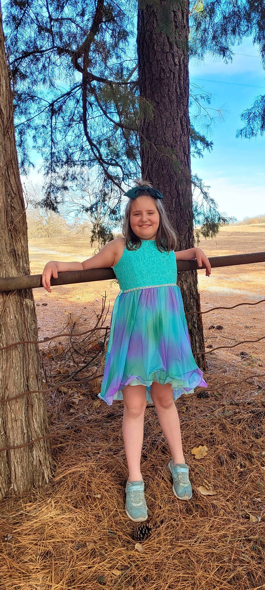 Athena is registered to the contest to win money with this photo: day_dress, dress, fawn, fun, grass, hairstyle, happy, joy, leaf, leg, long_hair, nature, people_in_nature, person, plant, sky, sleeve, smile, standing, tree