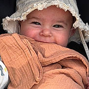 Noah participe au concours pour gagner de l'argent avec cette photo : baby, child, face, hat, blanket, smile, eyes, skin, fabric, clothing, portrait, closeup, cute, headwear, infant, wrapped, warm, happy, babywearing, cozy