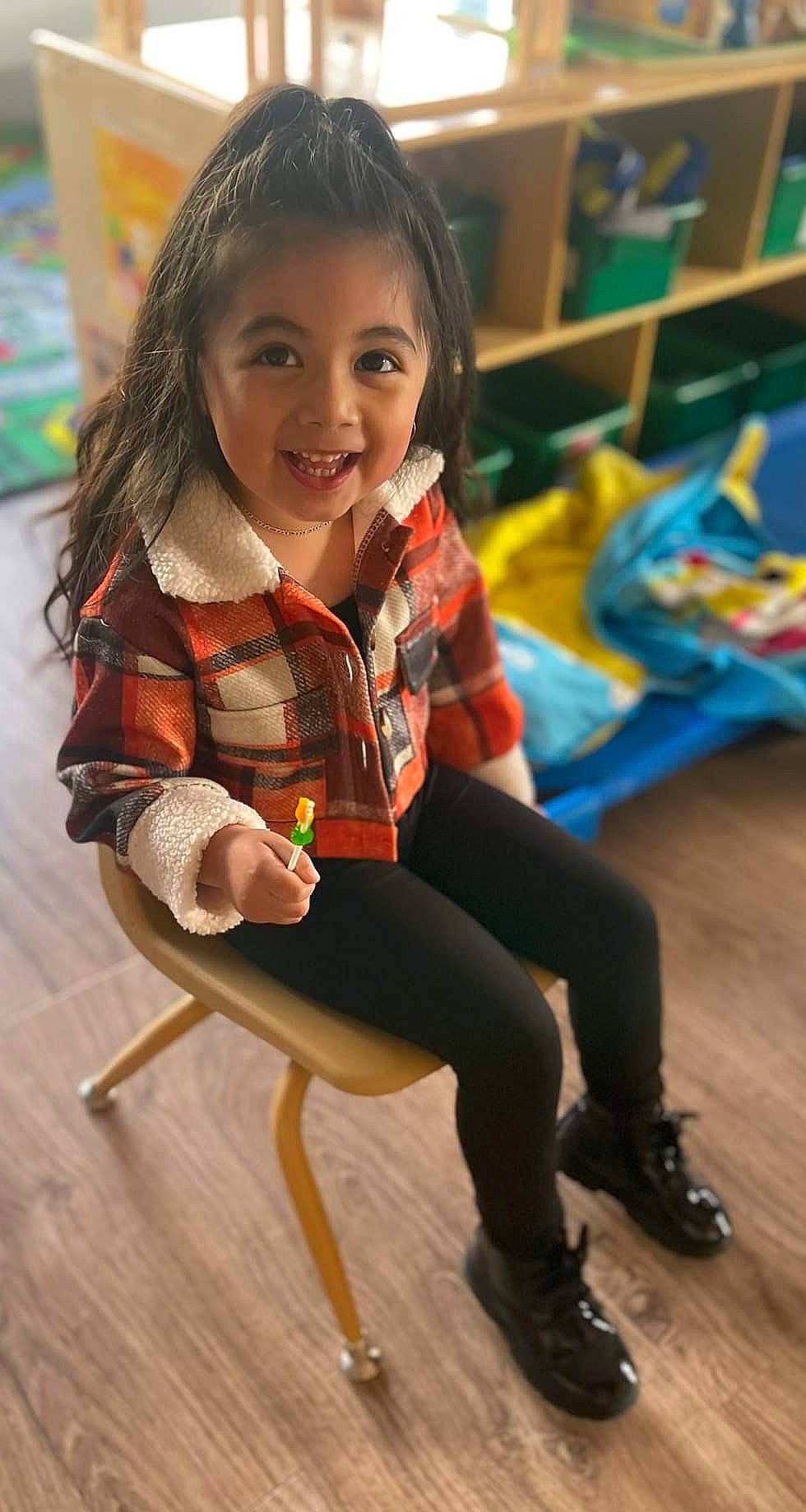 Melanie joined the competition — help win amazing prizes! chair, child, event, fashion_design, flooring, fun, hair, hairstyle, happy, human_leg, joy, knee, leg, leggings, leisure, person, sandal, shoe, smile, sneakers