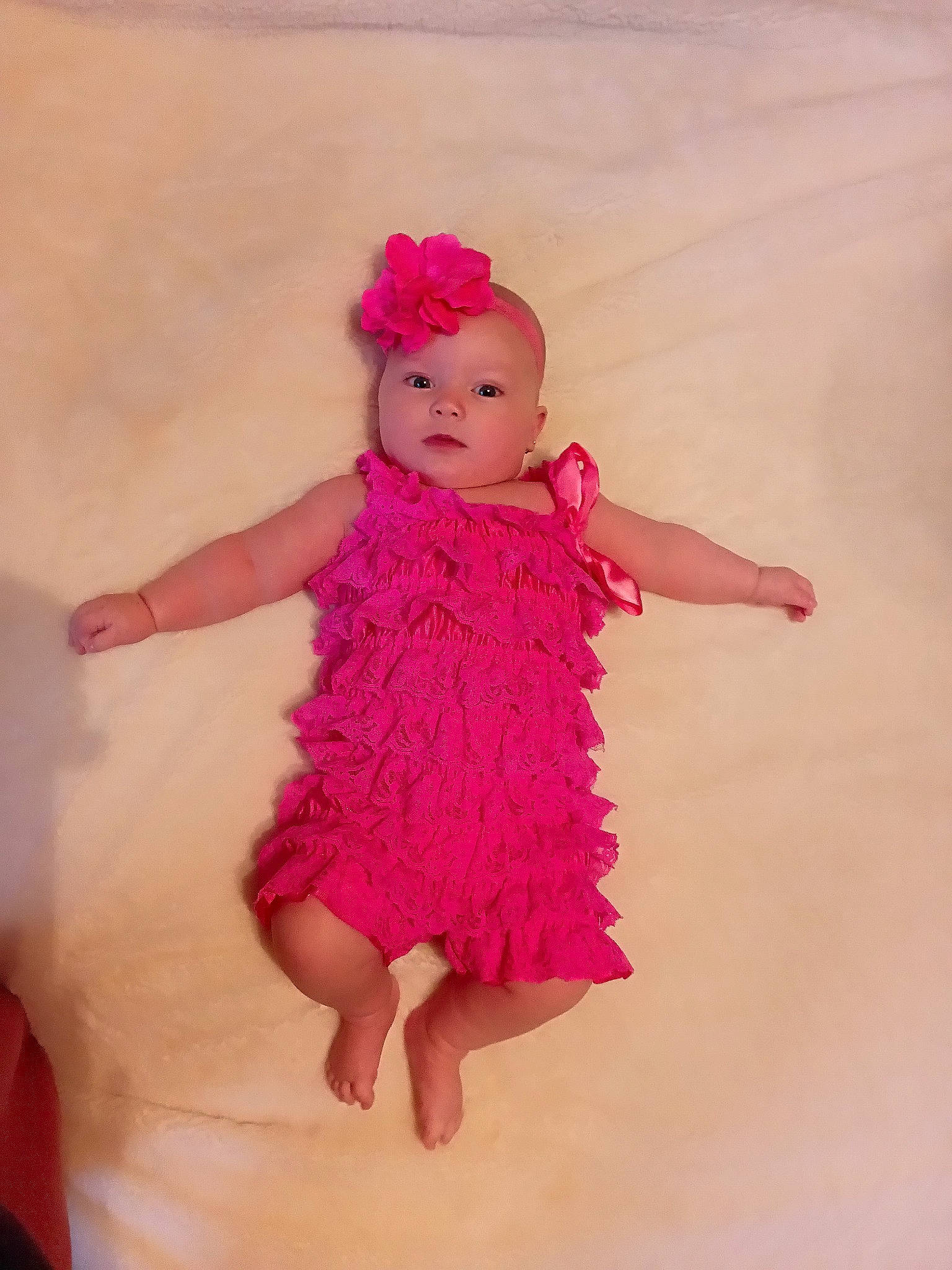 Fallon is registered to the contest to win money with this photo: arm, baby_toddler_clothing, day_dress, dress, fun, gesture, happy, lip, magenta, nail, neck, one_piece_garment, person, pink, shoulder, skin, sleeve, smile, thumb, toddler