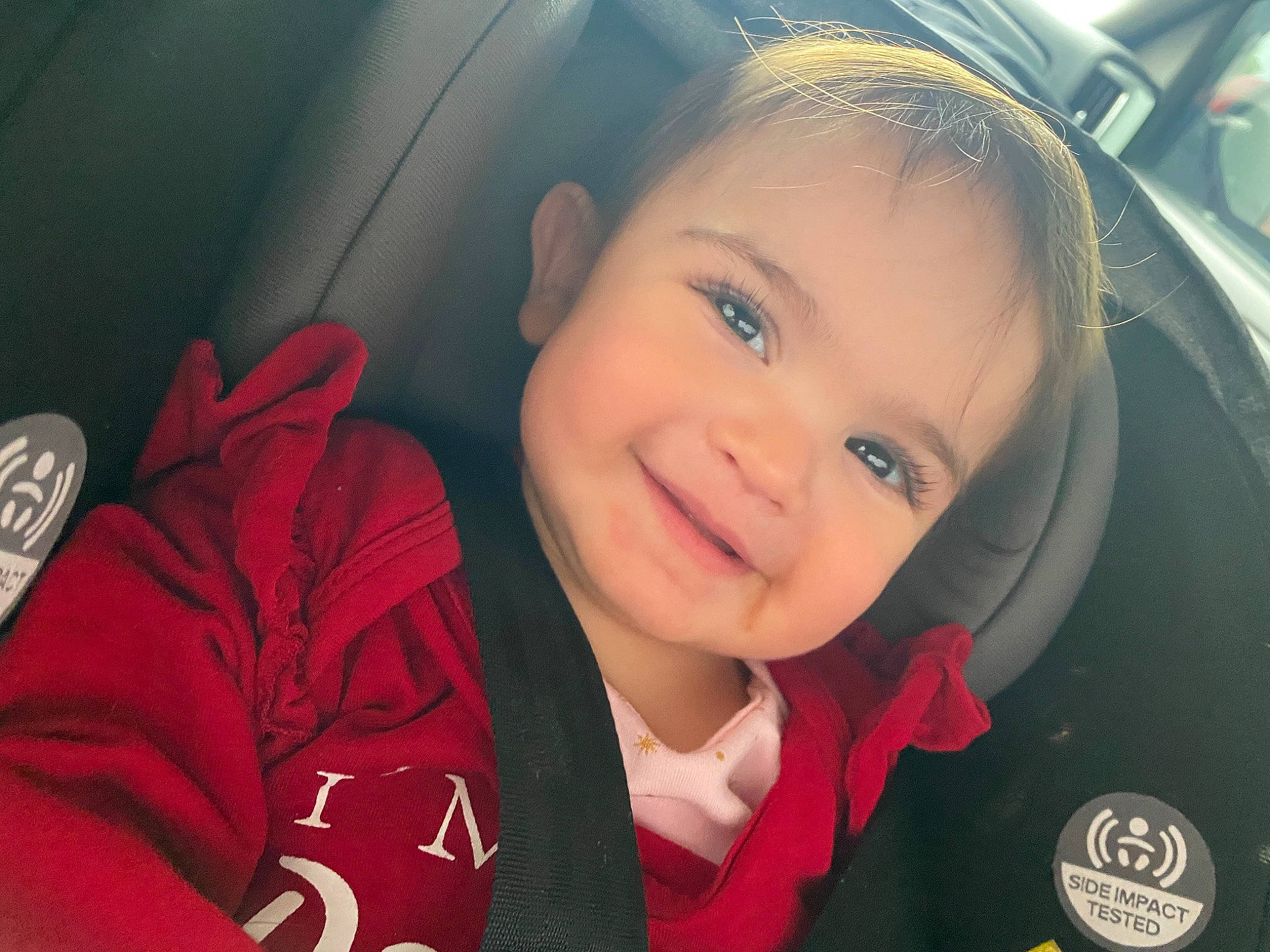 Raelynn is registered to the contest to win money with this photo: automotive_design, car, car_seat, car_seat_cover, child, cool, facial_expression, flash_photography, fun, happy, head_restraint, joy, motor_vehicle, person, personal_luxury_car, plant, smile, steering_part, steering_wheel, toddler