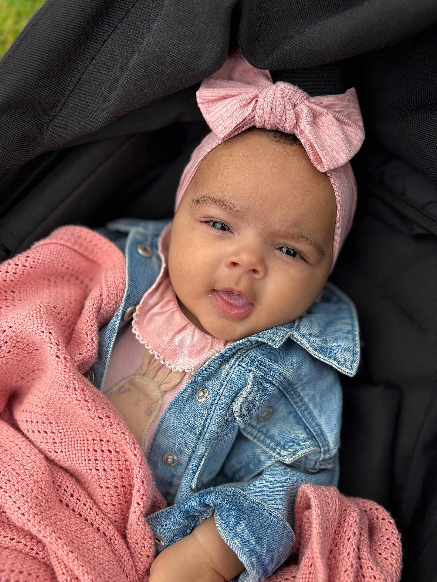 Alaiyah joined the competition — help win amazing prizes! baby, child, pink_bow, headband, denim_jacket, blanket, knit, stroller, portrait, cute, infant, clothing, face, skin, hand, young_child, warm, cozy, smile, outdoor
