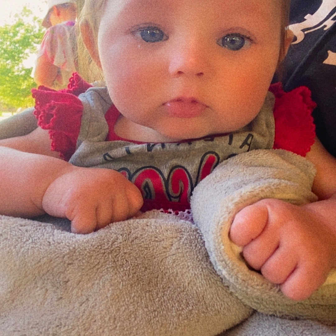 Bethany joined the competition — help win amazing prizes! baby, barefoot, blanket, bodypart, clothing, face, finger, hand, head, knitwear, newborn, pants, person, photography, portrait, quilt, sweater, toe, towel, toy