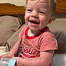 Parker joined the competition — help win amazing prizes! baby, babylaughing, bodypart, bottle, clothing, couch, face, furniture, happy, head, indoors, laughing, mouth, person, photography, portrait, shorts, sitting, smile, t_shirt