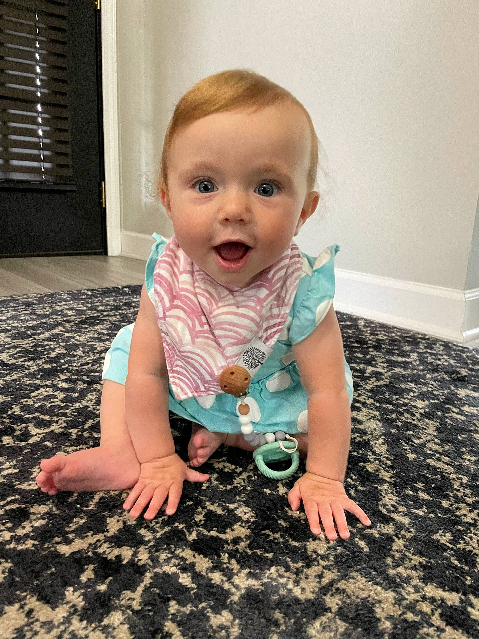 Sophia is registered to the contest to win money with this photo: baby, baby_toddler_clothing, cheek, finger, flash_photography, floor, flooring, fun, happy, head, iris, mouth, nose, person, pink, skin, sleeve, smile, standing, surprise