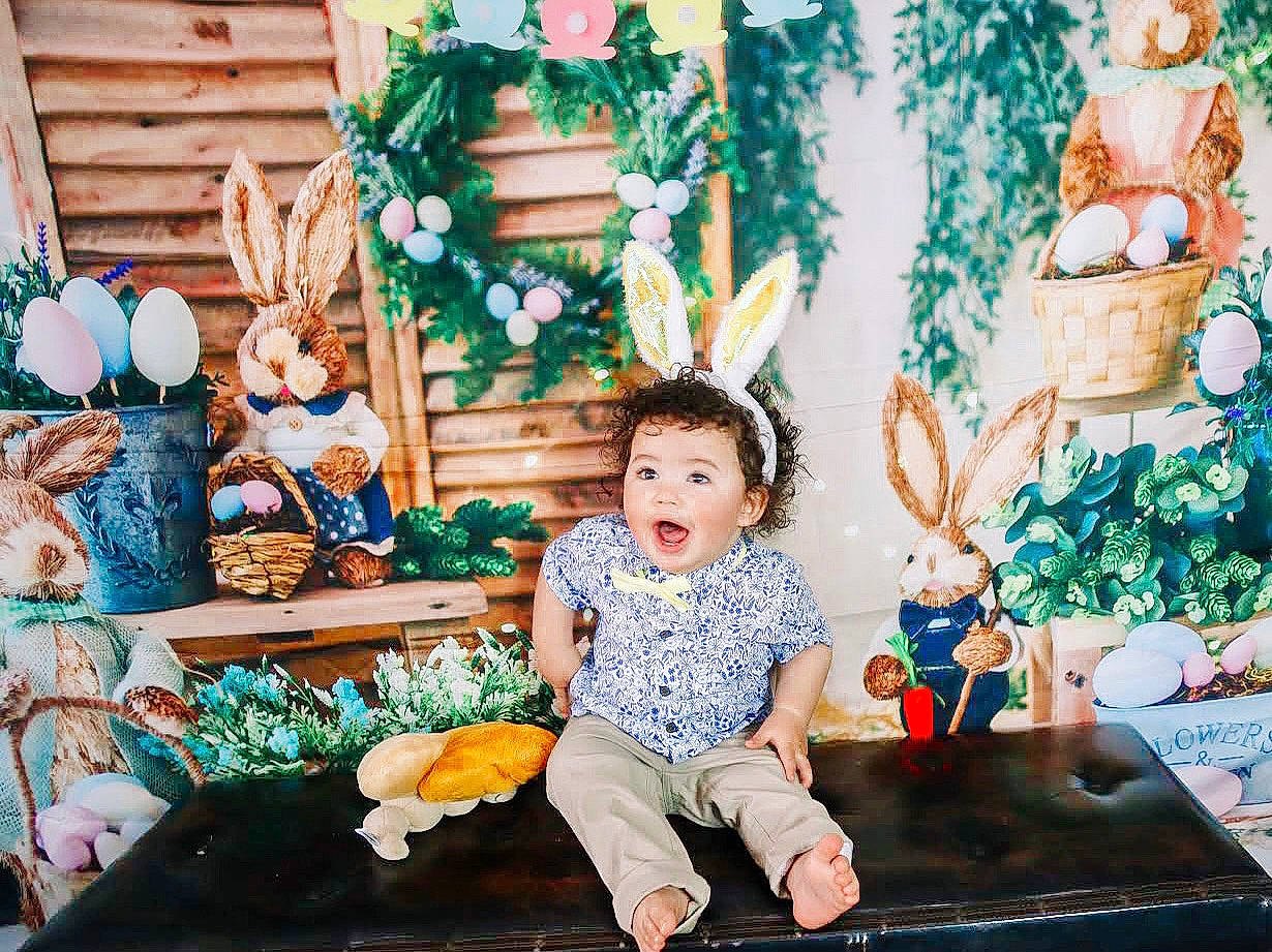 Azriel is registered to the contest to win money with this photo: baby_toddler_clothing, blue, chair, child, christmas_decoration, christmas_ornament, event, fun, green, happy, holiday, leisure, orange, ornament, people, person, photograph, room, surprise, toddler
