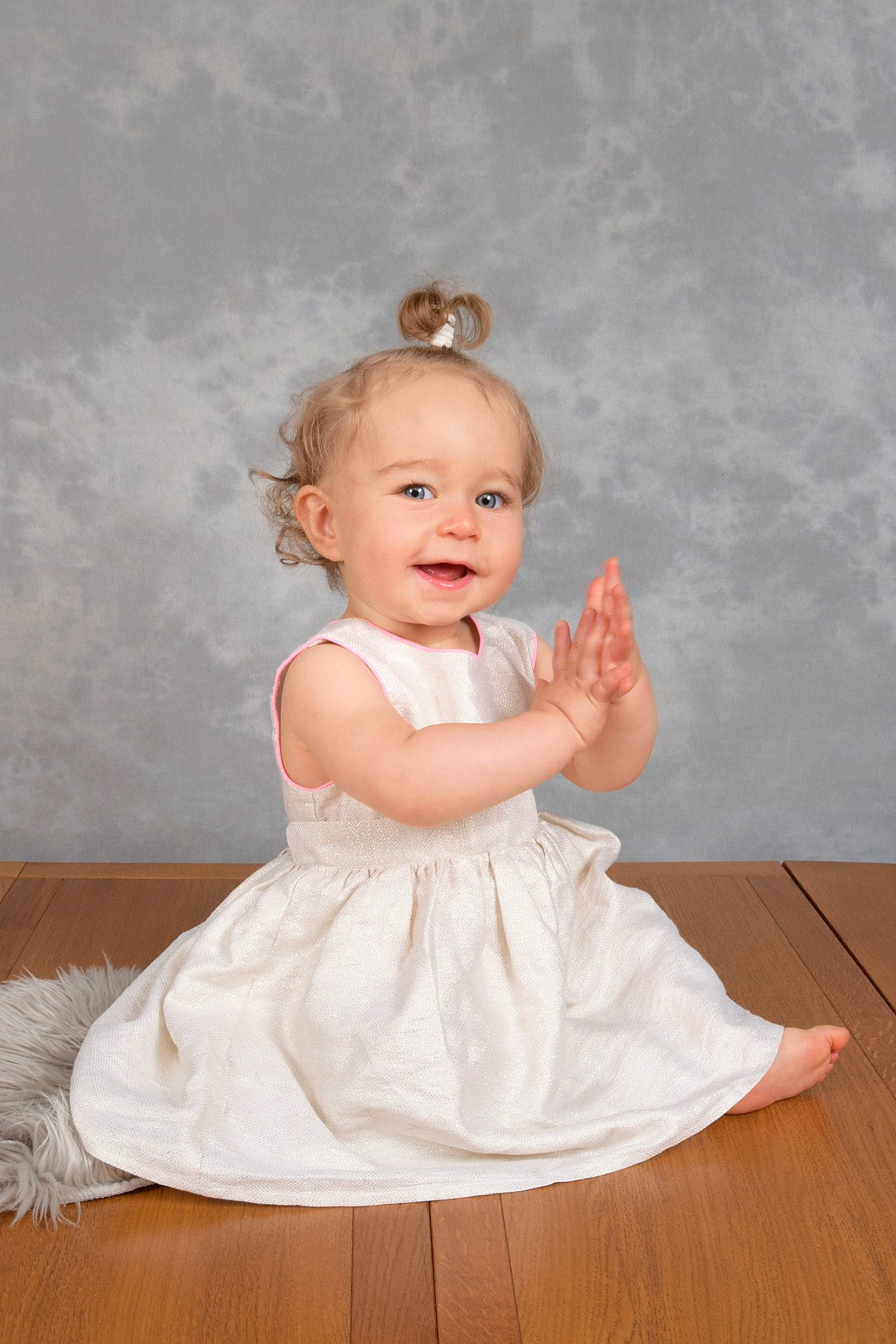 Louanne participe au concours pour gagner de l'argent avec cette photo : baby_toddler_clothing, bridal_accessory, cheek, day_dress, dress, eye, face, flash_photography, flooring, formal_wear, happy, hardwood, headpiece, iris, one_piece_garment, person, pink, sleeve, smile, toddler