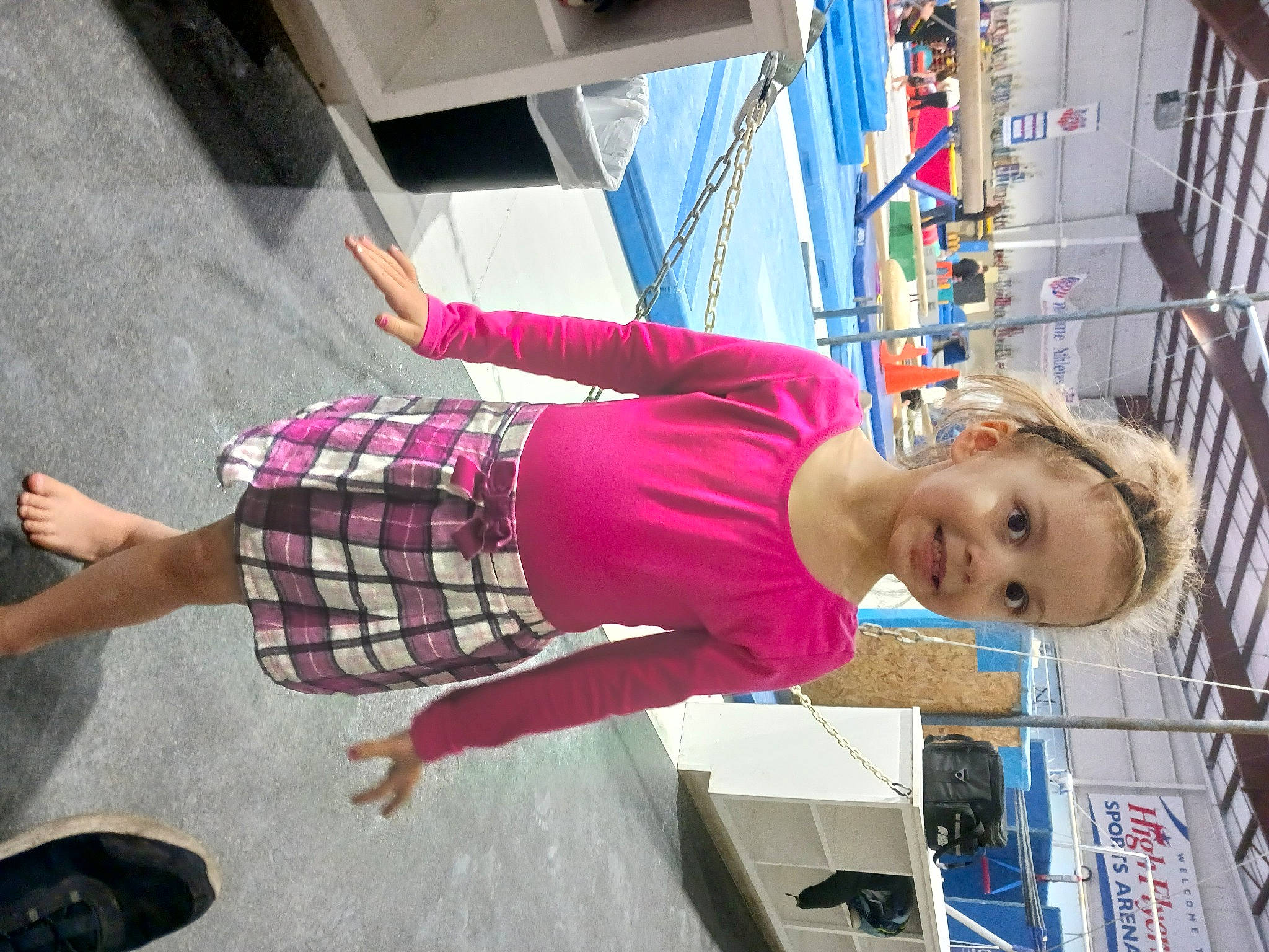 Lola is registered to the contest to win money with this photo: child, electric_blue, fun, human_leg, joy, knee, leisure, magenta, pattern, person, pink, plaid, shorts, smile, street, t_shirt, tartan, textile, thigh, travel