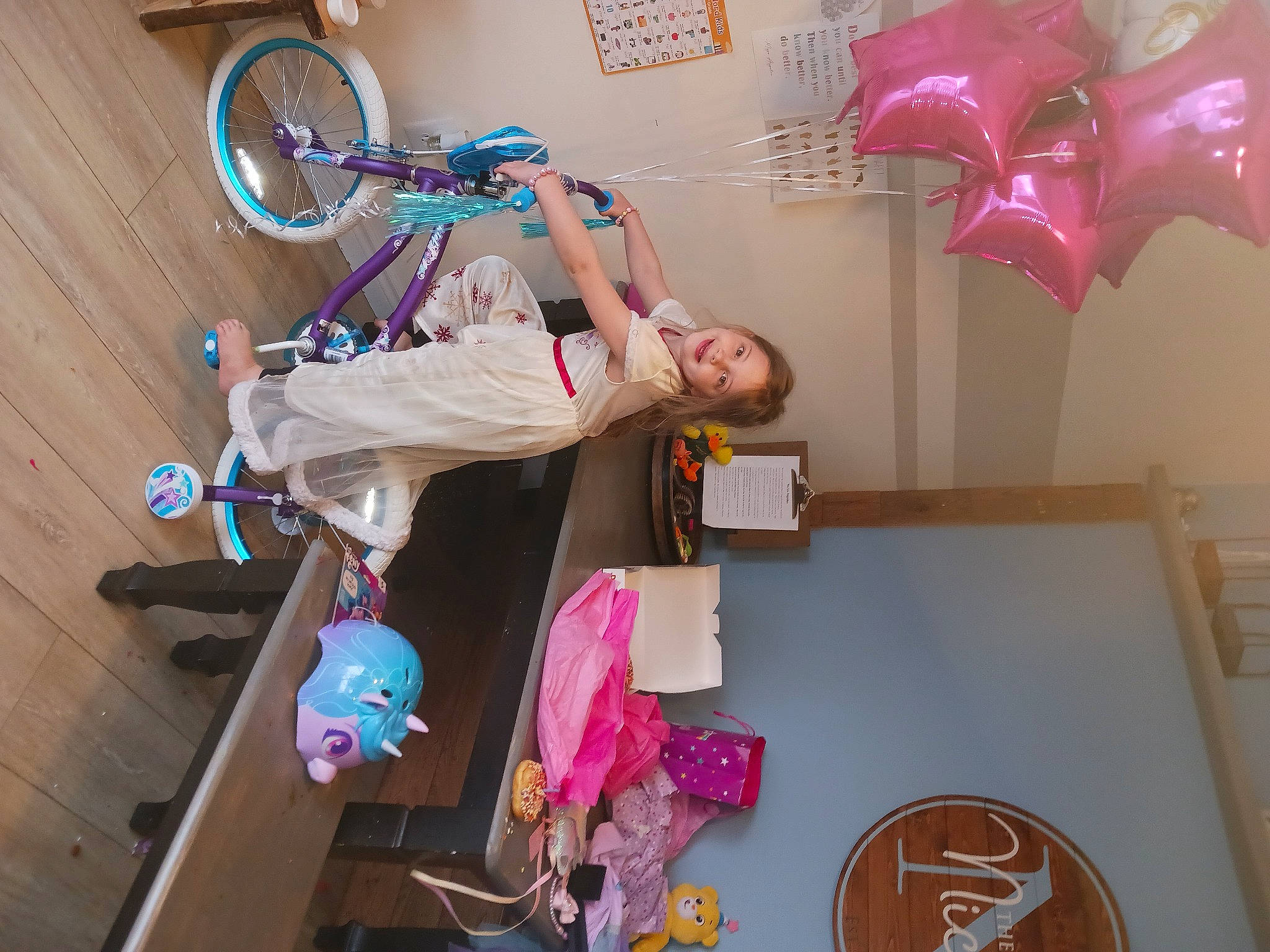 Lila joined the competition — help win amazing prizes! bicycle, bicycle_fork, bicycle_frame, bicycle_handlebar, bicycle_tire, bicycle_wheel, chair, child, fun, joy, magenta, party_supply, person, pink, plastic, recreation, room, spoke, tire, toy