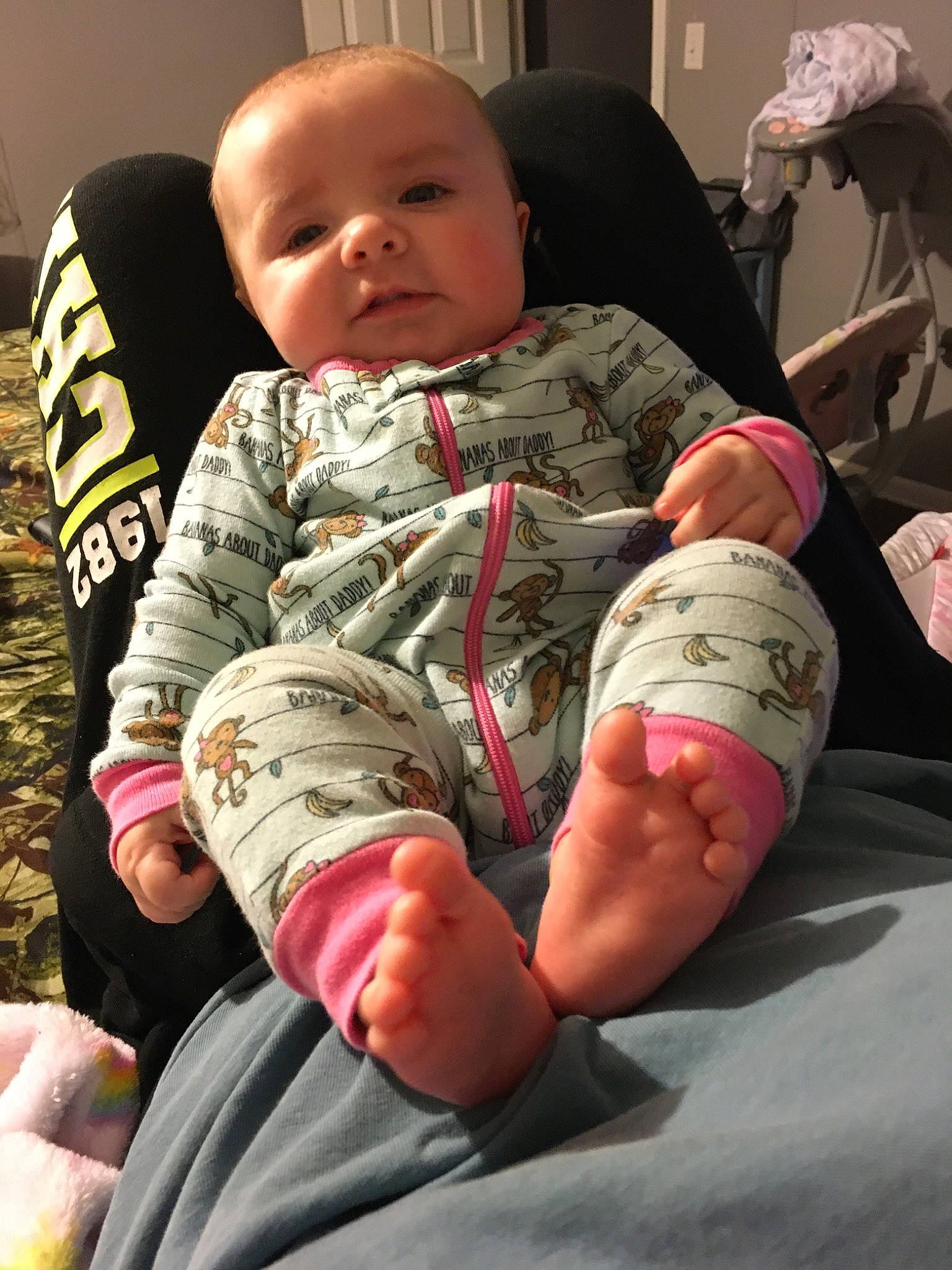 Loretta is registered to the contest to win money with this photo: arm, baby, child, finger, joint, leg, person, thumb, toddler