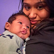 Noah Davon is registered to the contest to win money with this photo: accessories, adult, baby, bodypart, earring, face, female, happy, head, hugging, mouth, newborn, people, person, photography, portrait, selfie, smile, teeth, woman