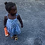 Carolina a rejoint le concours — aidez-le/la à gagner de superbes lots ! asphalt, bag, blue, casual, child, curious, dress, fox_design, greenery, hair_bun, orange, outdoor, person, polka_dot, sandals, shadow, standing, sunlight, toddler, young_child