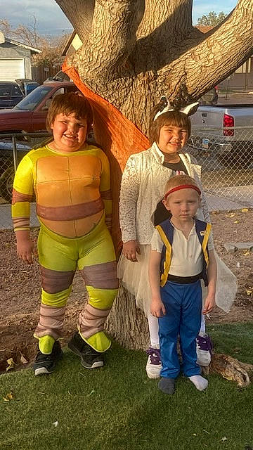 Scarlett is registered to the contest to win money with this photo: boot, footwear, fun, glove, grass, hat, headwear, joy, leaf, leg, leisure, outerwear, person, recreation, shoe, shorts, smile, sneakers, t_shirt, toddler