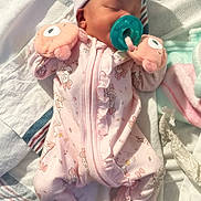 Serenity is registered to the contest to win money with this photo: baby, sleeping, pacifier, pink_clothing, mittens, bow_hat, blanket, soft_light, infant, cute, cozy, floral_pattern, newborn, resting, indoors, child, person, closeup, toddler, portrait