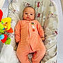 Nathan is registered to the contest to win money with this photo: baby, infant, onesie, orange_stripes, winnie_the_pooh, bassinet, toy, blanket, mesh_sides, cute, sleepwear, child, infant_clothing, baby_toys, soft_toys, lying_down, indoor, face, person, resting