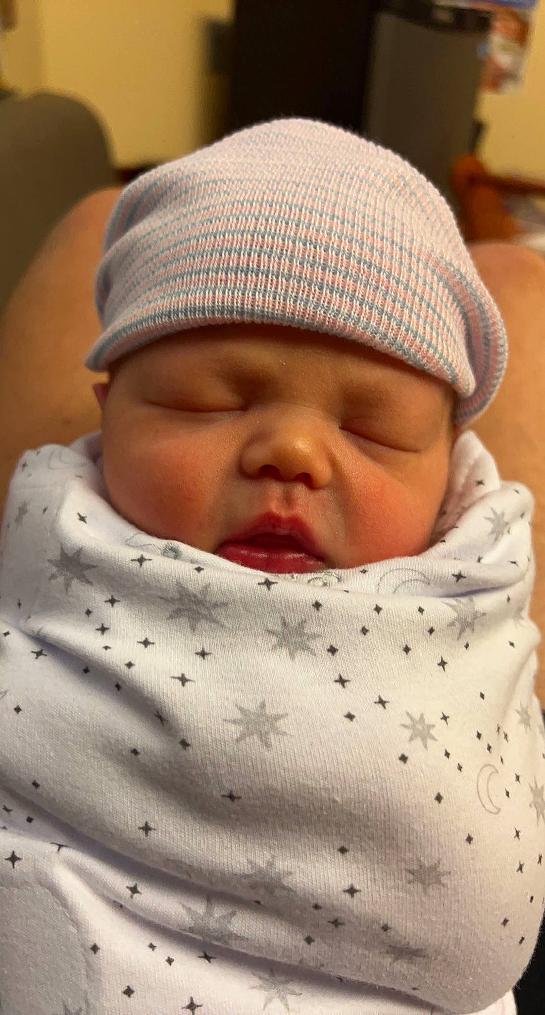 Lennon is registered to the contest to win money with this photo: baby, baby_sleeping, baby_toddler_clothing, cap, cheek, child, chin, close_up, collar, comfort, headwear, knit_cap, linens, lip, pattern, person, skin, sleeve, textile, toddler