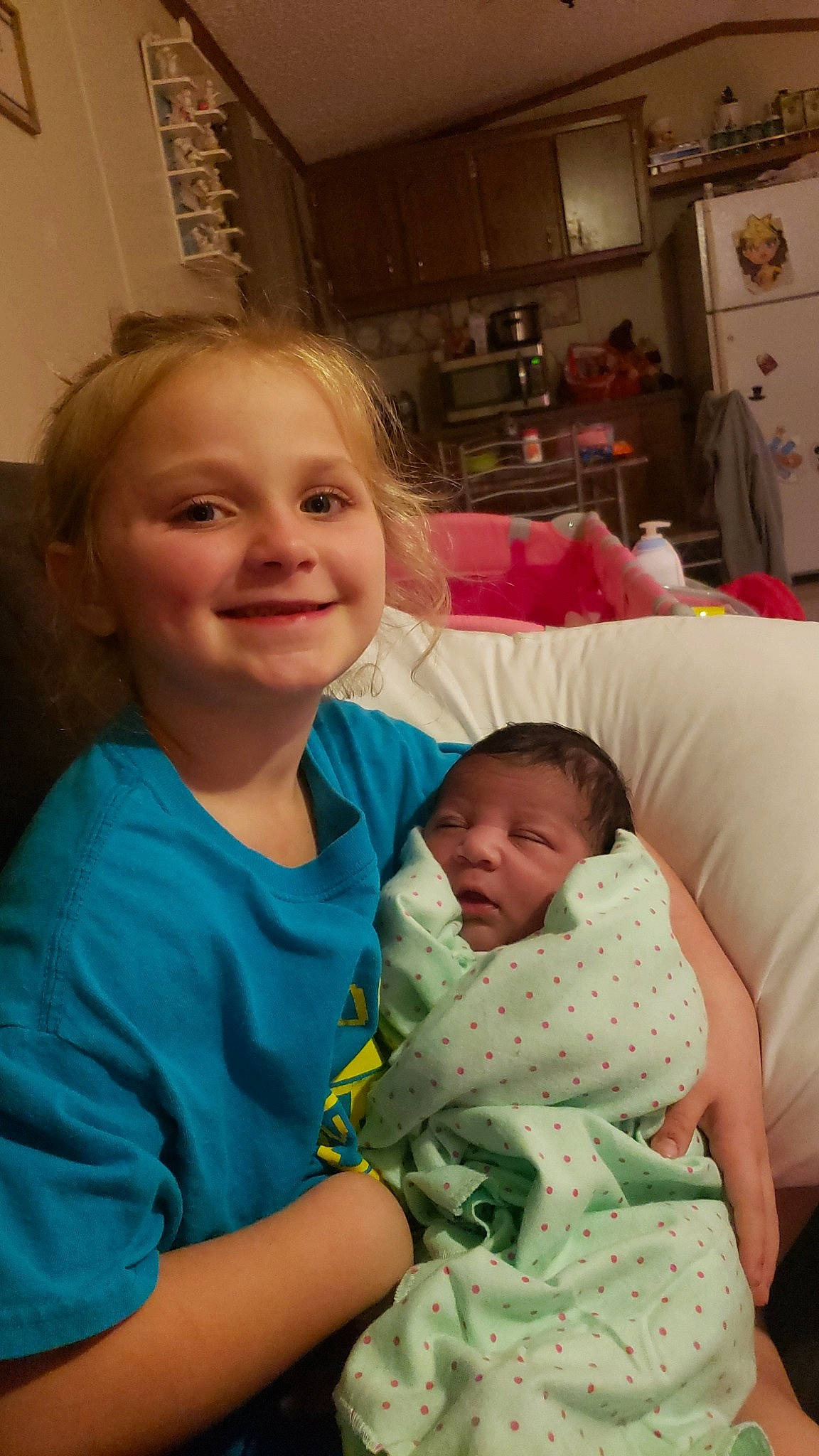 Allie joined the competition — help win amazing prizes! abdomen, baby, cheek, child, comfort, couch, event, eye, facial_expression, fun, happy, iris, joy, mouth, organ, person, picture_frame, room, skin, smile