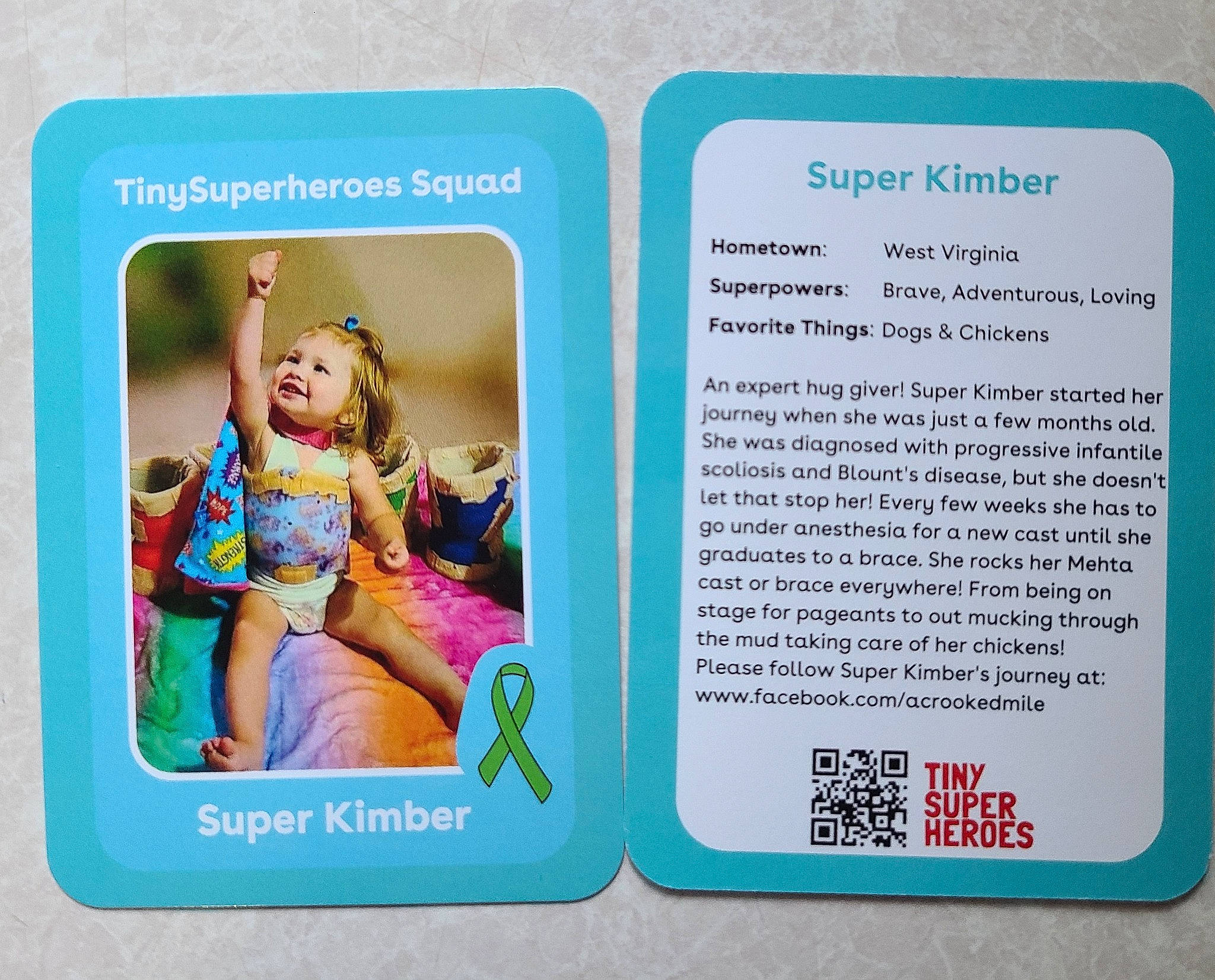 Kimber is registered to the contest to win money with this photo: art, child, circle, electric_blue, electronic_device, font, gadget, gesture, happy, joy, magenta, metal, paper_product, pattern, person, product, rectangle, room