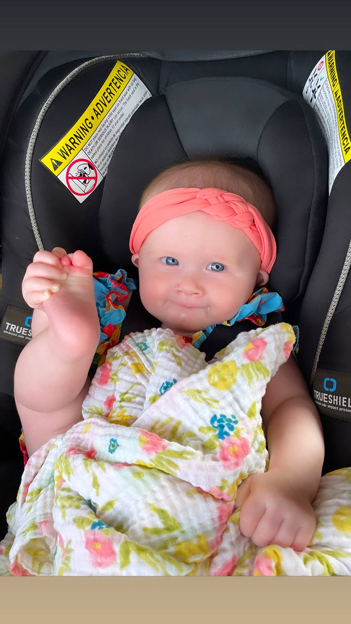 Scotland joined the competition — help win amazing prizes! baby, baby_carriage, baby_toddler_clothing, baseball_cap, beanie, cap, car_seat, cheek, child, comfort, facial_expression, fashion_accessory, headwear, helmet, person, personal_protective_equipment, pink, sitting, skin, sleeve