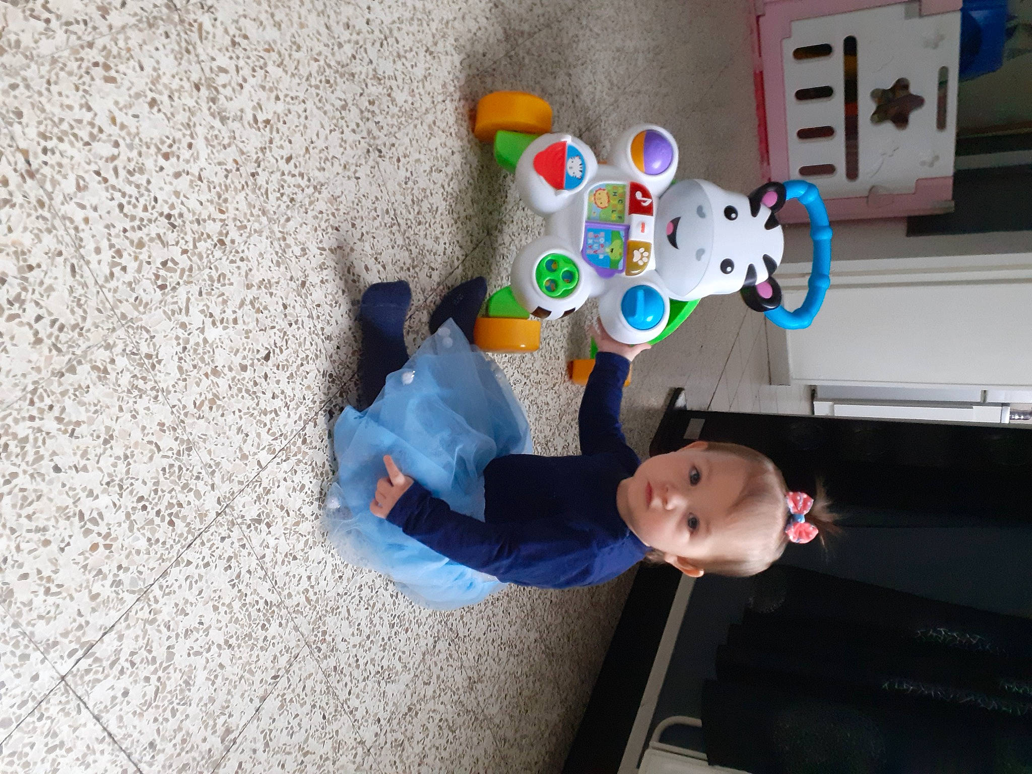 Lenna a rejoint le concours — aidez-le/la à gagner de superbes lots ! art, baby, baby_products, baby_toys, child, concrete, electric_blue, flooring, fun, machine, person, plastic, play, room, sitting, stuffed_toy, toddler, toy, visual_arts, walking_shoe