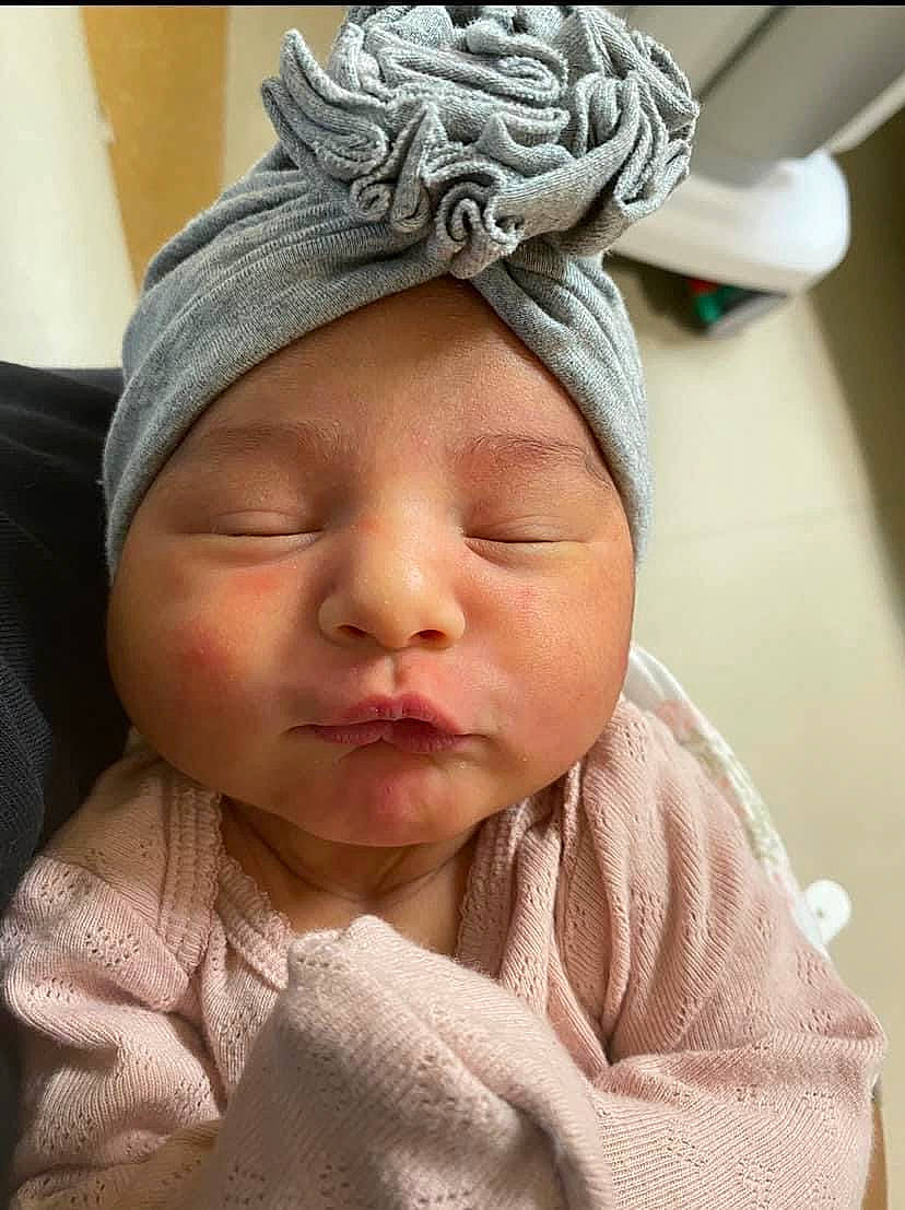 Naelani is registered to the contest to win money with this photo: baby, baby_sleeping, baby_toddler_clothing, cap, cheek, comfort, eyelash, face, fashion_accessory, forehead, hair_accessory, happy, headgear, headwear, linens, nose, person, skin, sleeve, smile