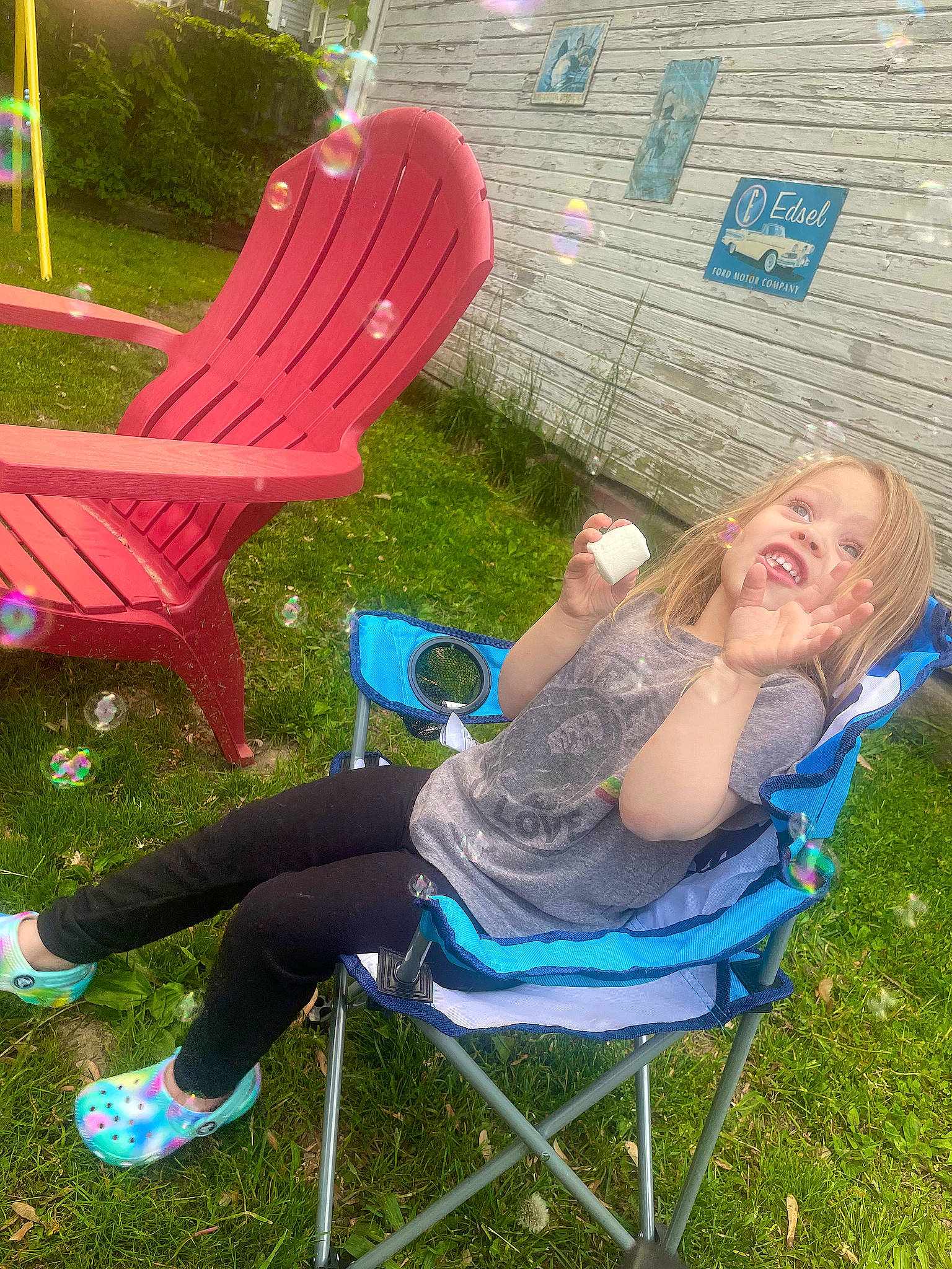 Brynnlee joined the competition — help win amazing prizes! beauty, chair, comfort, fun, furniture, grass, grass_family, green, happy, lawn, leg, leisure, morning, outdoor_furniture, person, plant, recreation, smile, sneakers, summer