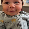 Roman joined the competition — help win amazing prizes! baby, smile, face, infant, clothing, onesie, dinosaur_pattern, happy, cute, portrait, child, indoors, soft_light, closeup, head, person, newborn, apparel, expression, warm