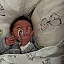 newborn, baby, pacifier, blanket, butterfly, winnie_the_pooh, tigger, bed, sleeping, infant, hand, clothing, cute, soft, pattern, child, wrapped, comfort, indoors, rest