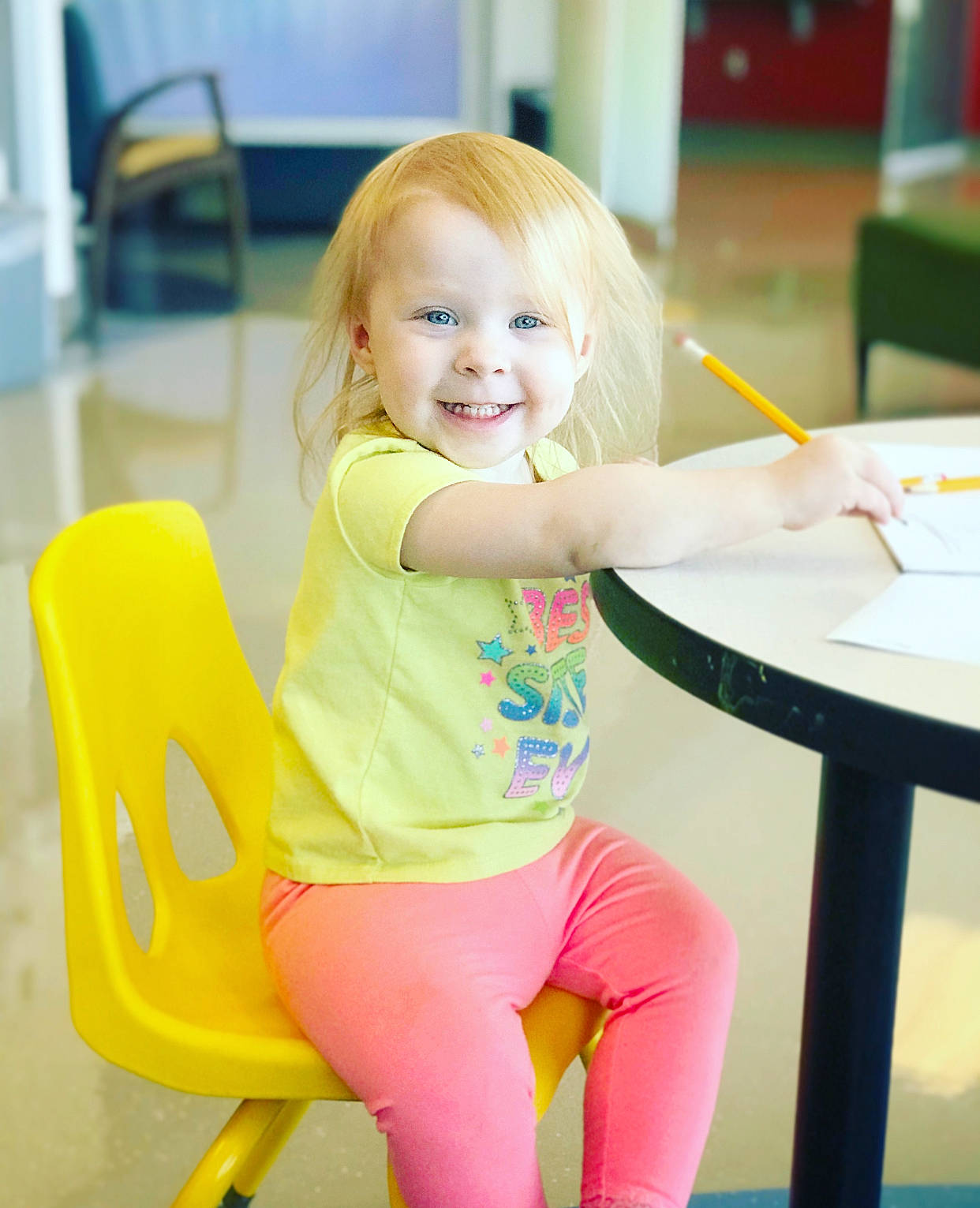 Harper is registered to the contest to win money with this photo: beauty, blond, chair, child, child_model, furniture, joy, leg, leisure, person, play, sitting, smile, toddler, yellow