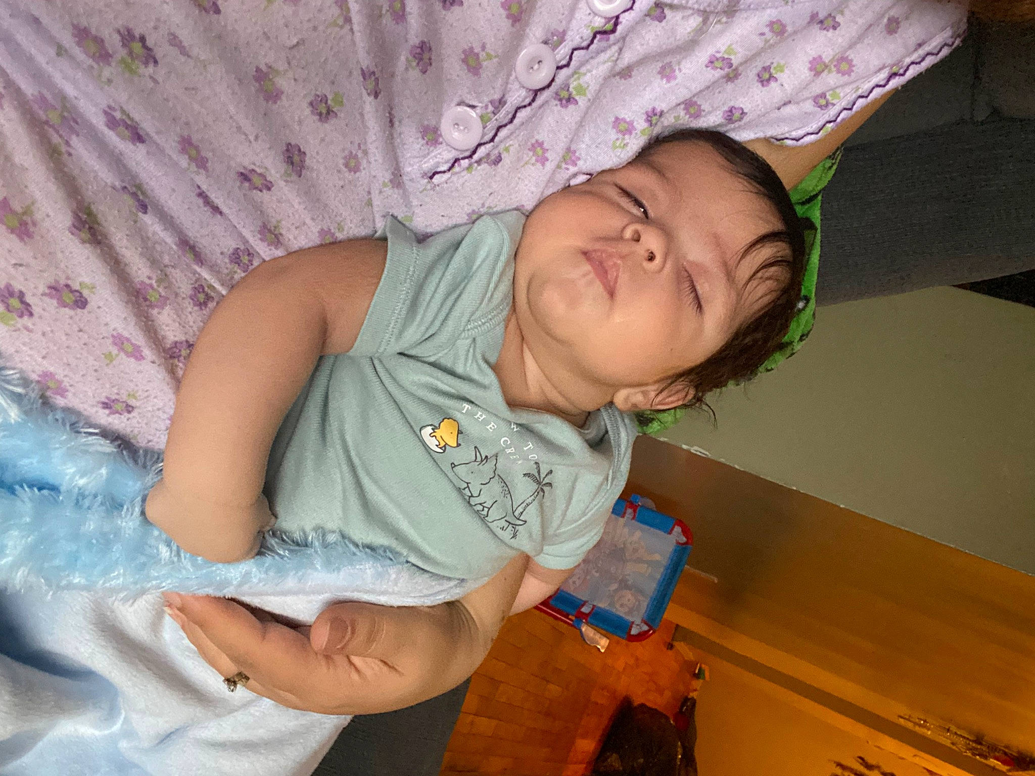 Isaac joined the competition — help win amazing prizes! baby_toddler_clothing, box, child, comfort, finger, hand, iris, linens, pattern, person, room, shipping_box, sitting, skin, sleeve, t_shirt, textile, toddler, varnish, wood