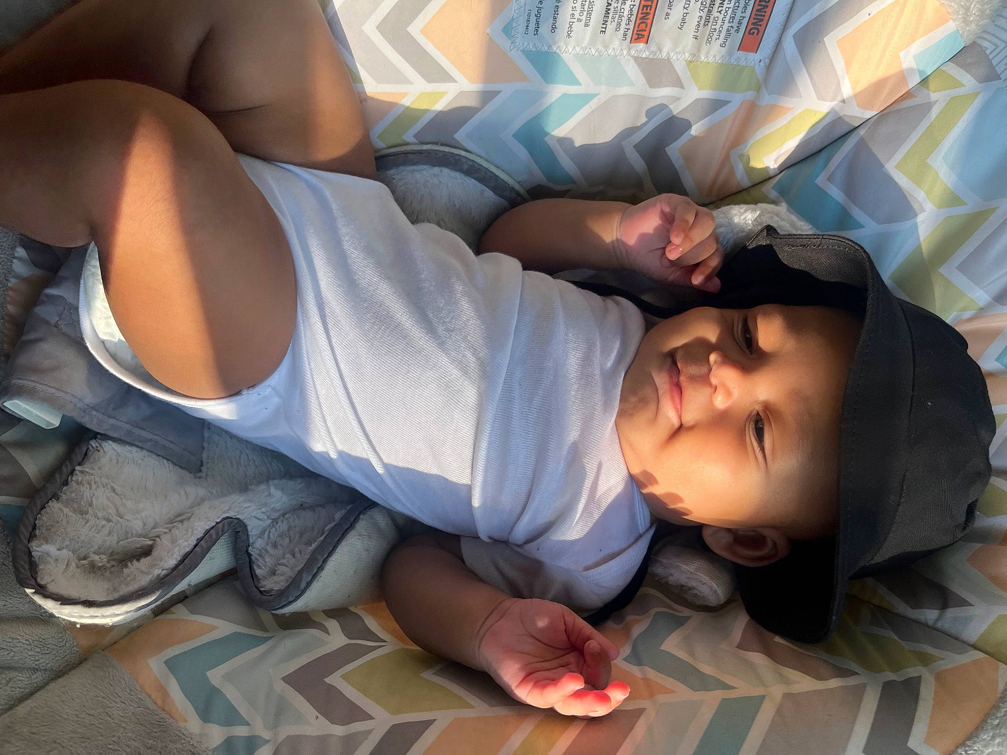 Jaylin joined the competition — help win amazing prizes! arm, black_hair, child, comfort, elbow, finger, flooring, fun, headwear, human_leg, joint, knee, leisure, linens, muscle, person, room, shorts, sitting, t_shirt
