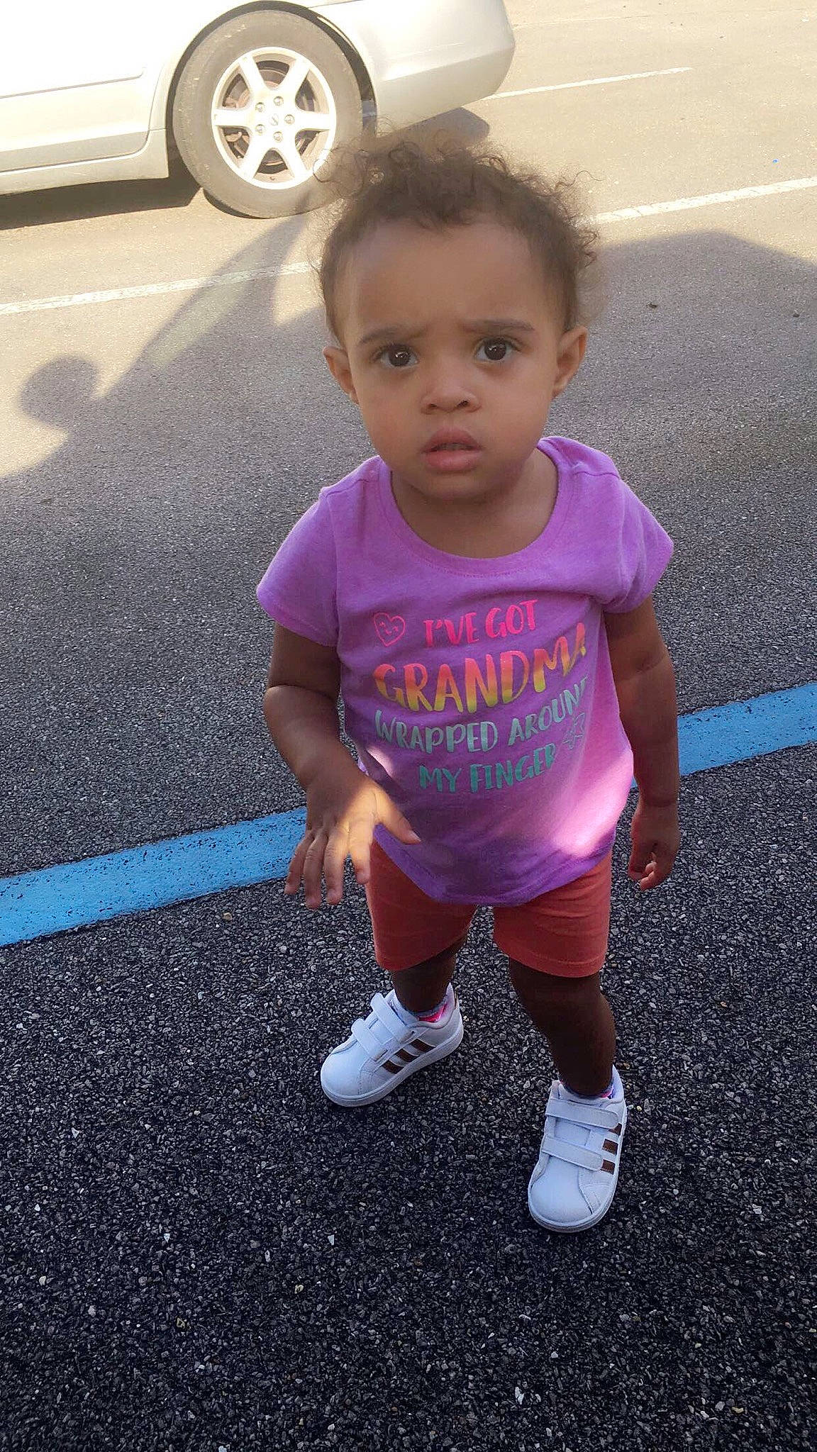 Kynslee is registered to the contest to win money with this photo: asphalt, baby, child, fun, head, person, pink, play, purple, shoe, smile, standing, summer, t_shirt, toddler, vacation, walking