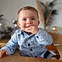 Marius participe au concours pour gagner de l'argent avec cette photo : baby, child, blue_eyes, smiling, cute, shirt, patterned_clothing, hand, table, indoor, high_chair, face, person, happy, young, portrait, infant, furniture, home, sitting