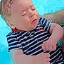 baby, child, swimsuit, striped_clothing, pool, water, floating, person, skin, arm, hand, head, closed_eyes, summer, outdoor, cute, infant, relaxing, swimming, parent