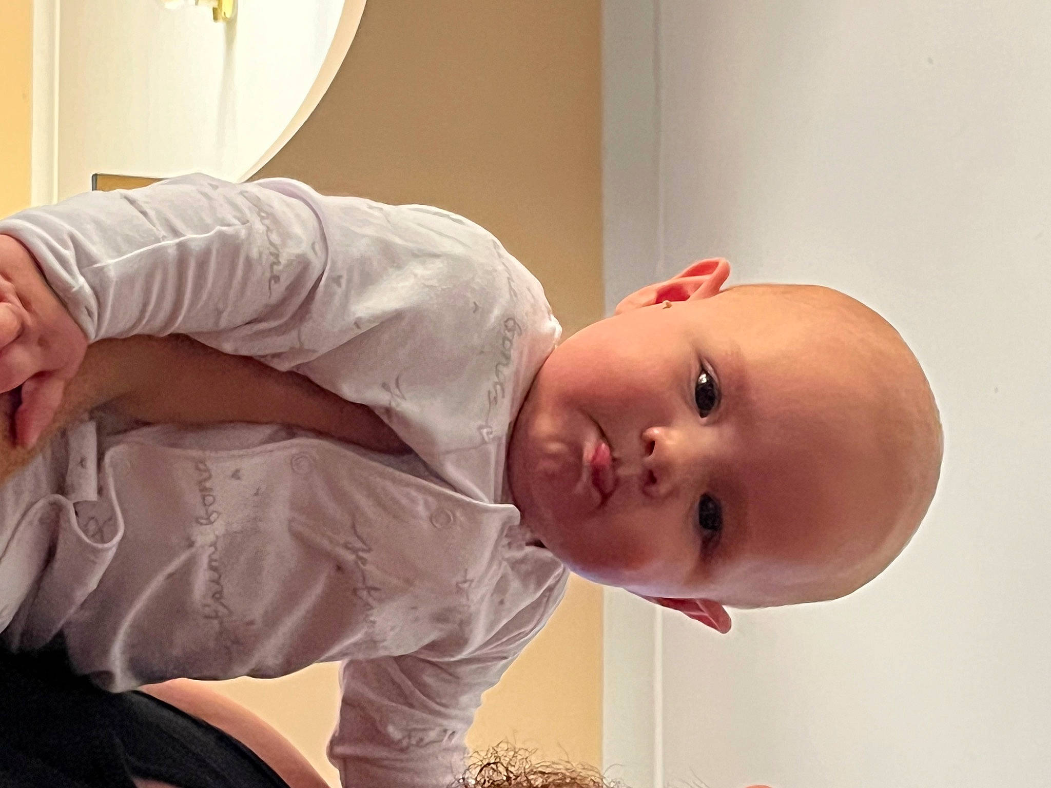 Jay is registered to the contest to win money with this photo: baby, baby_toddler_clothing, cheek, child, comfort, elbow, eye, happy, mouth, nose, person, room, shoulder, skin, sleeve, smile, toddler