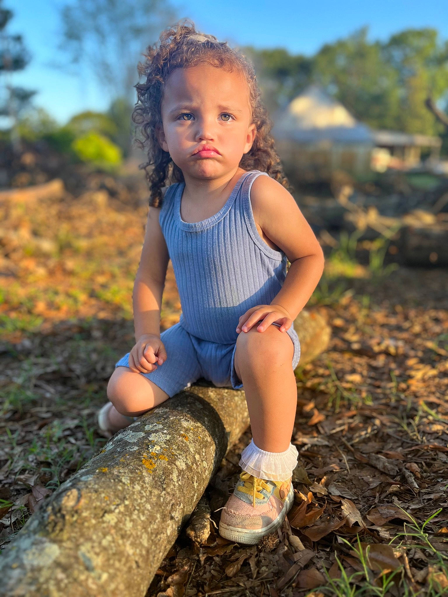 Kennedy is registered to the contest to win money with this photo: baby_toddler_clothing, child, face, flash_photography, grass, hair, hairstyle, happy, head, leg, people_in_nature, person, plant, sky, sneakers, summer, sunlight, thigh, toddler, tree