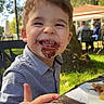 Maylonn participe au concours pour gagner de l'argent avec cette photo : child, boy, smiling, chocolate, face, outdoor, table, food, happy, daylight, grass, tree, shirt, person, nature, picnic, laughter, snack, sunlight, fun
