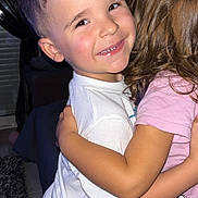Maylonn a rejoint le concours — aidez-le/la à gagner de superbes lots ! child, boy, girl, hug, smile, indoor, tshirt, shorts, happy, friendship, affection, hair, skin, face, arm, childhood, person, clothing, closeup, portrait