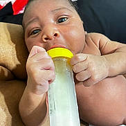 Xzayvion joined the competition — help win amazing prizes! baby, infant, bottle, feeding, hand, face, skin, closeup, newborn, child, cute, expression, person, holding, mouth, nurture, rest, comfort, young, portrait