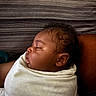 Xzayvion joined the competition — help win amazing prizes! baby, sleeping, infant, wrapped, blanket, curly_hair, peaceful, side_profile, portrait, cozy, child, resting, soft_light, indoors, close_up, cushion, striped_background, skin, human, relaxation