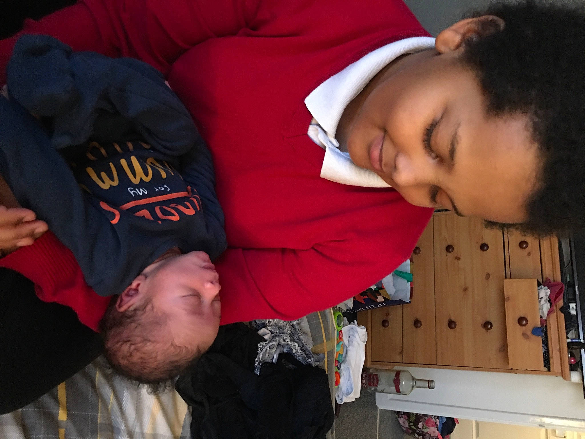 Bailey Nixon is registered to the contest to win money with this photo: arm, carmine, cheek, child, chin, comfort, elbow, event, finger, forehead, fun, happy, joint, mouth, organ, person, photograph, red, sleeve, snapshot