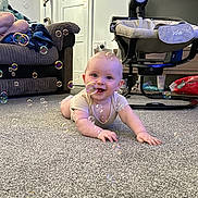 Thomas joined the competition — help win amazing prizes! baby, child, crawling, carpet, bubbles, indoor, sofa, person, baby_rocker, door, floor, smiling, clothing, head, hand, toy, furniture, living_room, happy, home