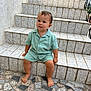 toddler, child, steps, tile, barefoot, outdoor, curious, green_clothing, mosaic_floor, sitting, person, young_child, texture, pattern, casual, daylight, concrete, wall, portrait, expression