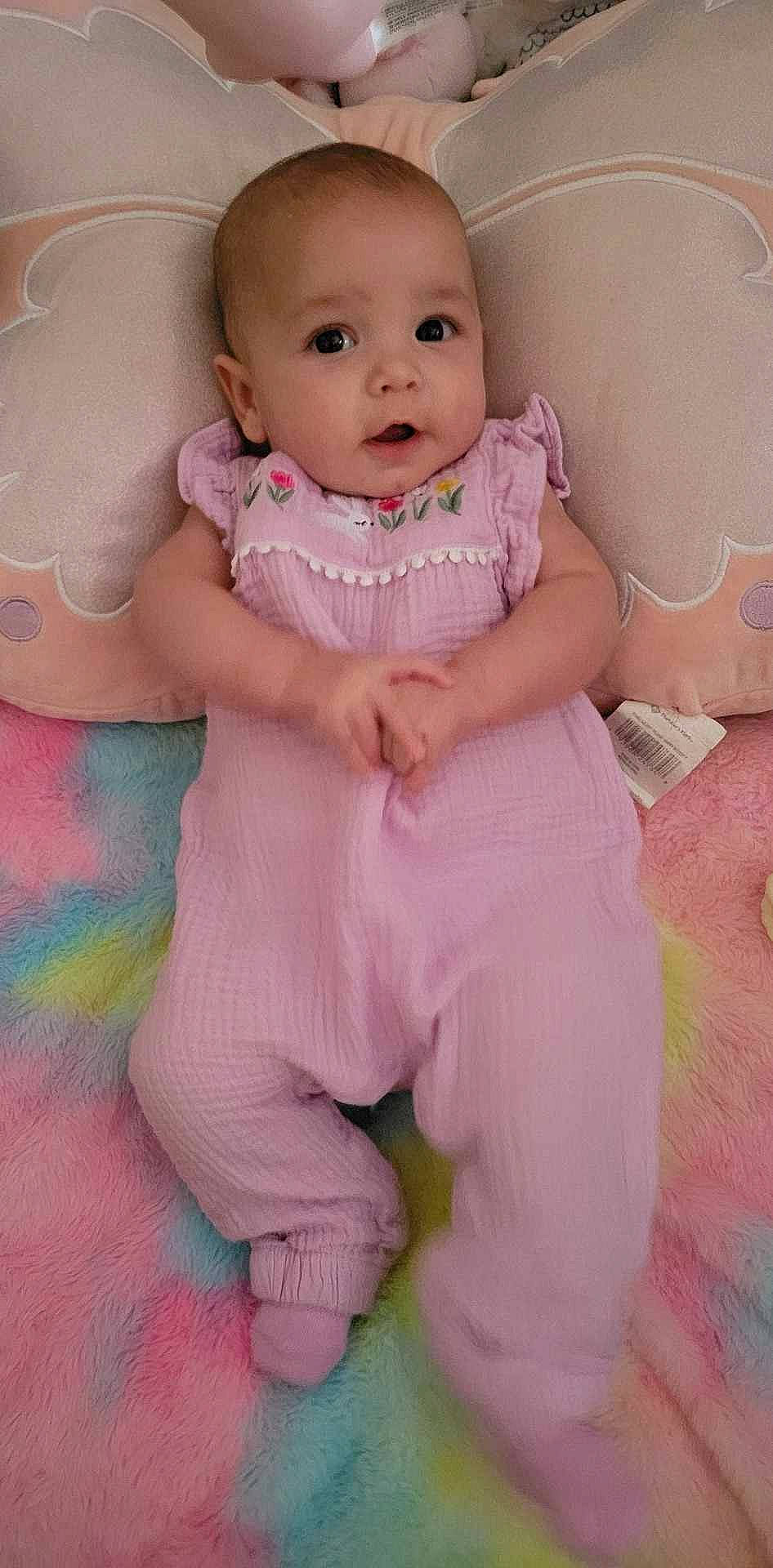 Kinsleigh is registered to the contest to win money with this photo: baby, baby_toddler_clothing, cheek, child, comfort, dress, face, flooring, gesture, happy, leg, lip, nail, neck, person, pink, skin, sleeve, stomach, thumb