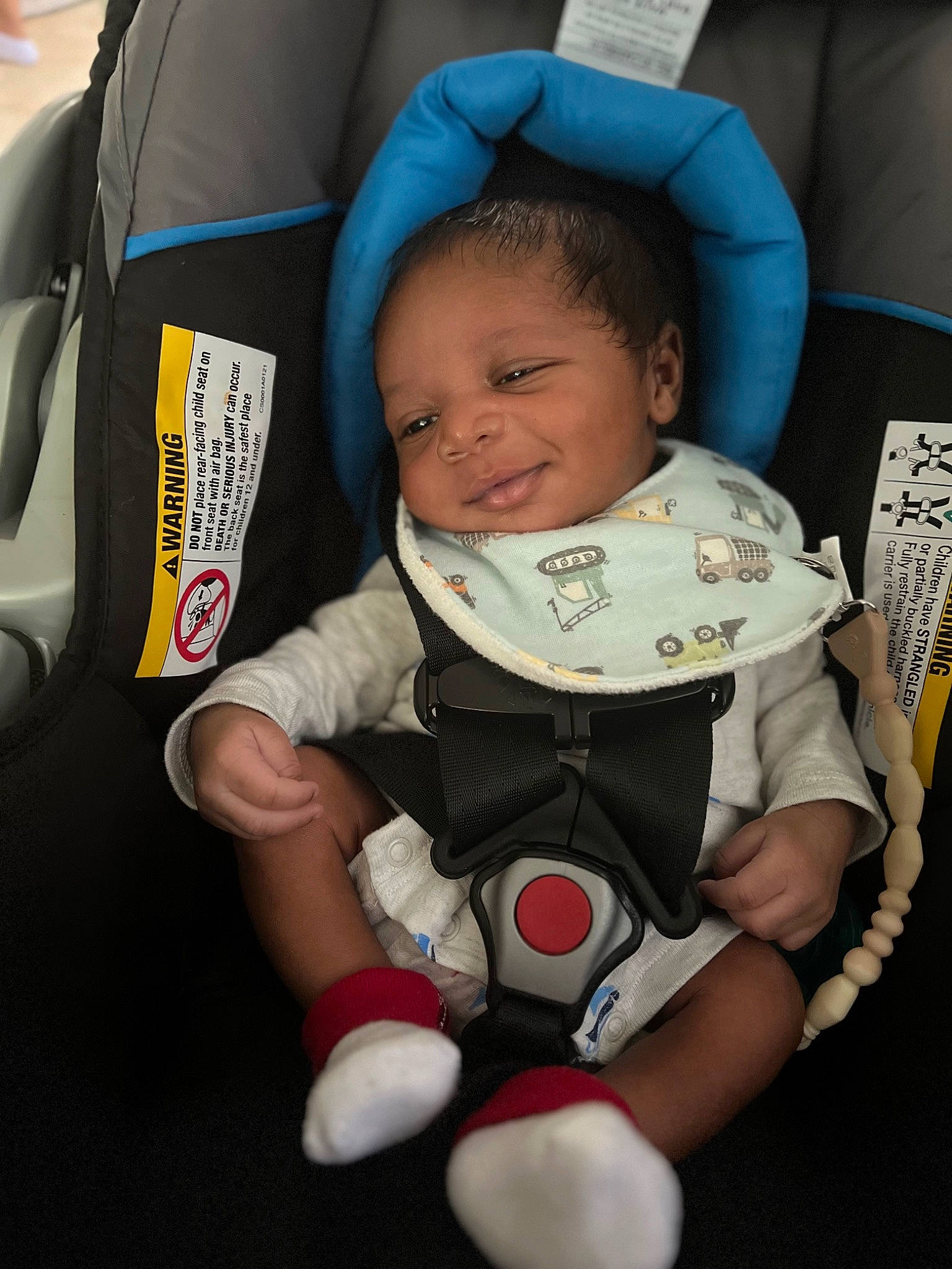 Channing is registered to the contest to win money with this photo: auto_part, baby, baby_carriage, baby_in_car_seat, baby_products, baby_safety, baby_toddler_clothing, car_seat, cheek, child, comfort, design, facial_expression, finger, person, product, sitting, skin, sleeve, thumb