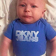 Virgil is registered to the contest to win money with this photo: baby, infant, blue_shirt, dkny_jeans, white_pants, polka_dots, blanket, lying_down, face, expression, cute, child, young, portrait, indoors, soft_lighting, clothing, person, head, eyes